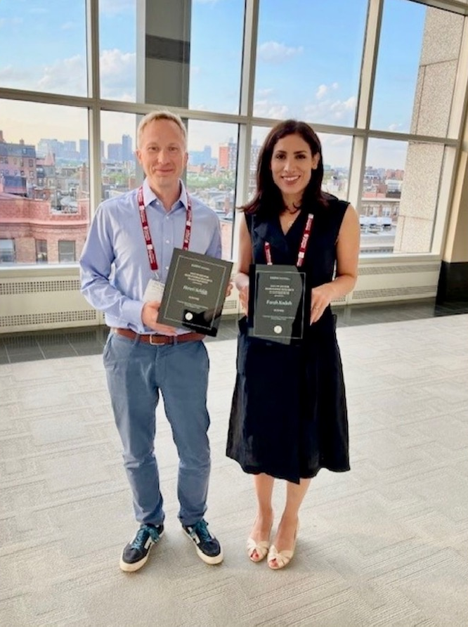 Farah Kodeih and Henri Schildt holding their Award for Responsible Research in Management plaques